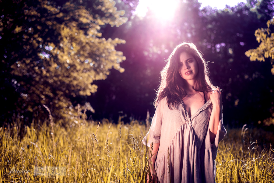girl jasmine 2016 standing in sun on meadow